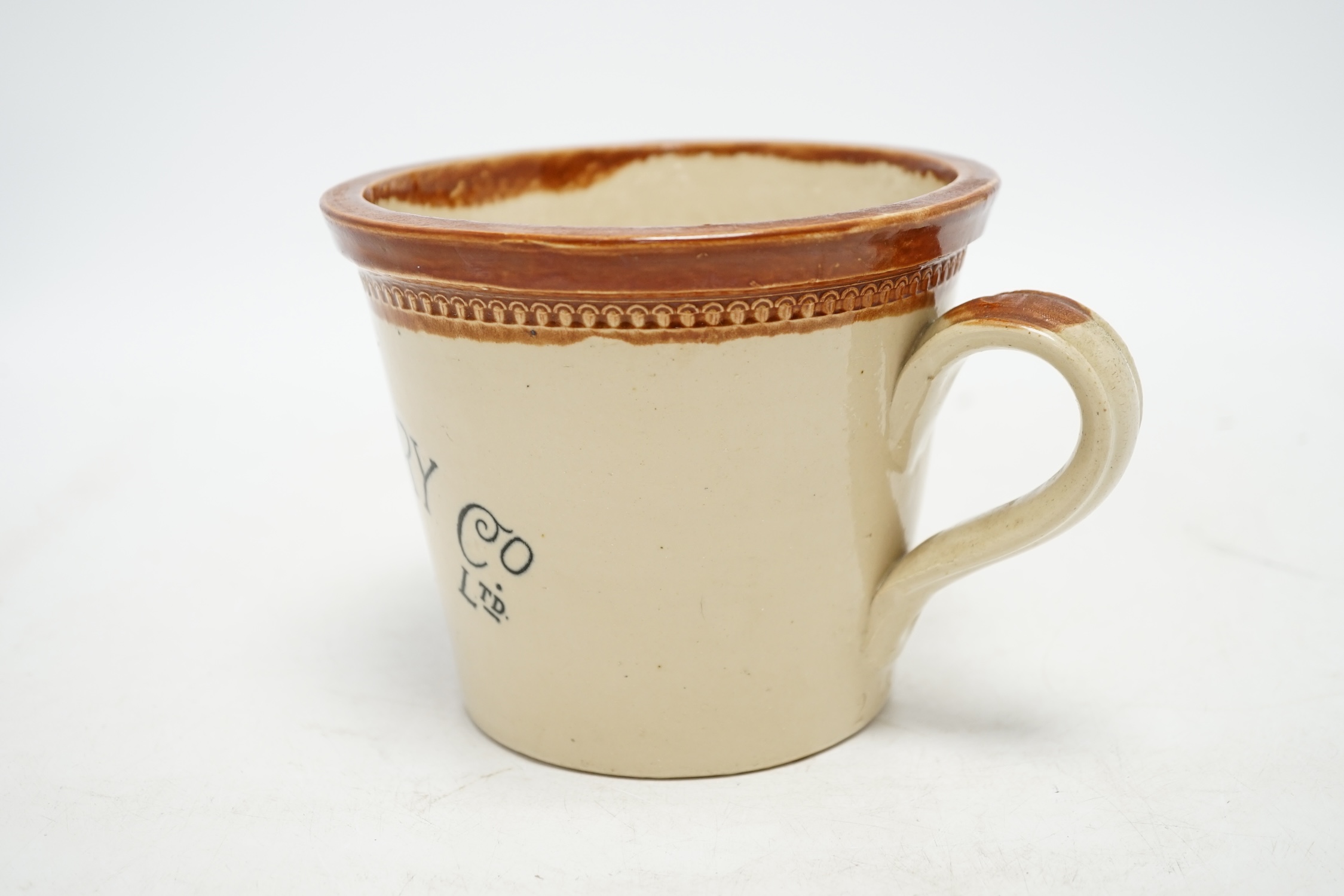 A late 19th century Maypole Dairy Co Ltd butter crock with handle, 12cm tall. Condition - fair